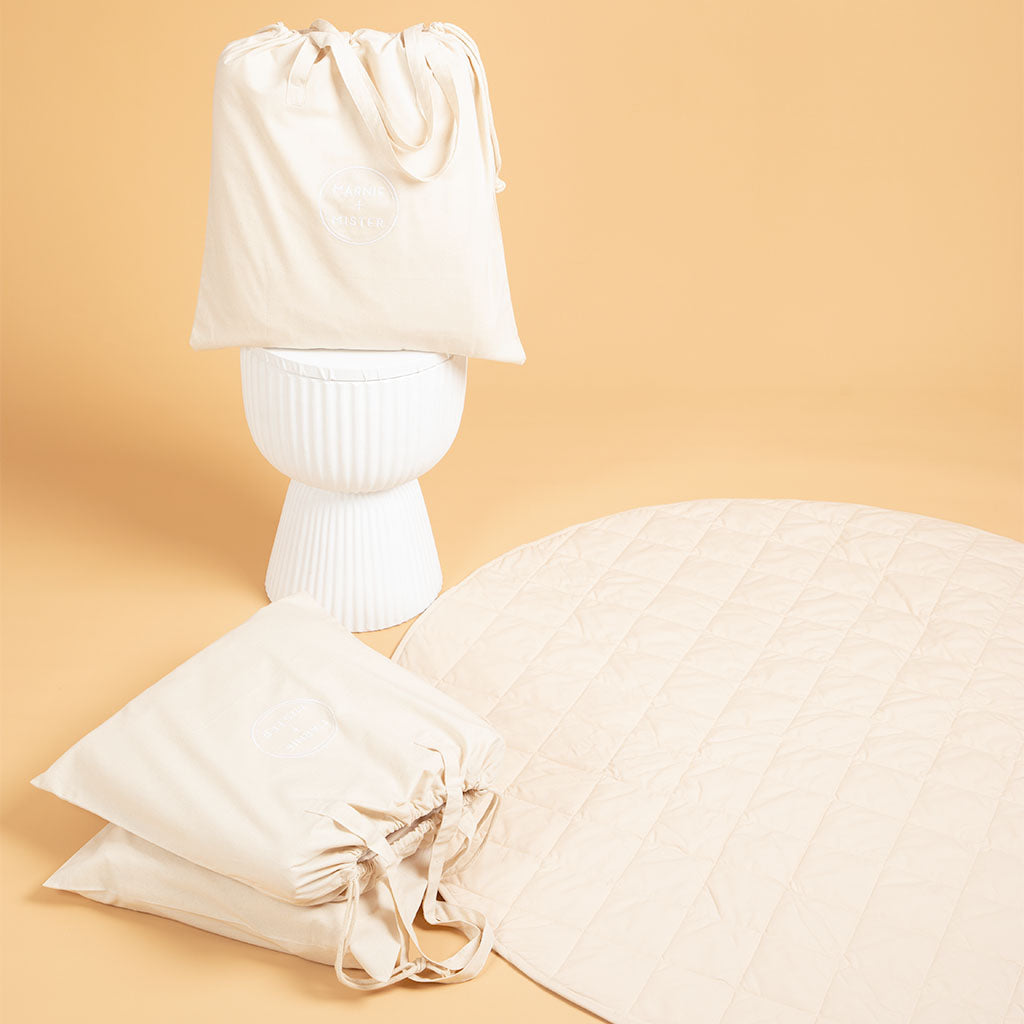 styled scene with tote bags and organic cotton play mat